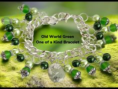 "Our Old World Green beaded bracelet is a one of a kind as only one will be made insuring a treasured memory for you.   The bracelet is a approx 8\" shiny bright silver tone continuous link chain with a large and secure lobster clasp Each glass bead of 3 different colors green is attached with a Silverplated double split ring for added security and beauty. The center is adorned by a polished light green accent stone. The bracelet will come gift boxed at no extra charge Also we are offering to ad Green Beaded Bracelets, Christmas Charms, Colors Green, Green Accents, Split Ring, Handmade Artisan, Adjustable Bracelet, Glass Bead, Charm Bracelets