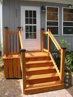 a porch with steps leading up to the front door