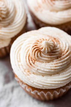 several cupcakes with frosting on top of each one