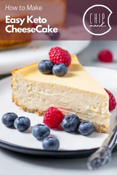 a piece of cheesecake on a plate with blueberries and raspberries