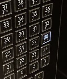 a close up of a metal door with numbers on it