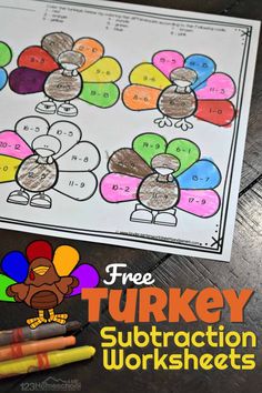 a turkey subtraction worksheet with two crayons next to it