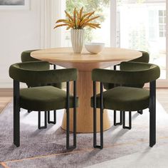 a round table with four green chairs around it and a white vase on the top