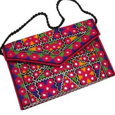 Multi-Color Embroidered Flower Design. 1 Zipper Compartment with External Multi-Color Embroidered Flower design. Easy to wear on your shoulder. Stylish and elegant Traditional Sindhi Shoulder bag and Clutch. Good idea for Gifts, Birthdays and Wedding etc. High- Quality Sindhi Shoulder Bag of Size: 30×19 2.55 cm. Traditional Multicolor Embroidered Clutch, Embroidered Clutch For Festivals, Multicolor Embroidered Handwork Clutch, Rectangular Embroidered Multicolor Clutch, Embroidered Rectangular Shoulder Bag, Embroidered Shoulder Bag Clutch, Pink Rectangular Shoulder Bag With Handwork, Multicolor Floral Embroidered Clutch For Festivals, Traditional Embroidered Summer Clutch