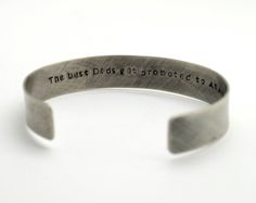 "Oxidized Sterling Silver Personalized 1/2 in wide Cuff Bracelet, Double Sided, Gift for Man, Anniversary, Father's Day Hidden Message, Wedding, Keepsake This beautiful cuff with rustic finish makes a perfect gift for both men and women. It is hand stamped with the text of your choice - I can be names, phrase, song lyrics. It can be stamped on the inside or outside of the bracelet up to 60 characters on either side. If you need a longer quote please contact me for pricing. Pictured cuff has a ox Rustic Stamped Cuff Bracelet Gift, Rustic Silver Bracelets For Gifts, Rustic Silver Bracelet For Gift, Rustic Stamped Bracelets For Gift, Rustic Stamped Bracelets For Gifts, Rustic Bangle Cuff Bracelet As Gift, Stamped Bangle Cuff Bracelet Gift, Father's Day Gift Cuff Bangle Bracelet, Father's Day Gift Cuff Bracelet