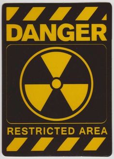 a yellow and black sign that says danger restricted area