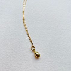 Solid 9ct Yellow Dainty Teardrop Pendant Necklace - handmade - Bohemian style necklace Beautifully simple teardrop pendant on a diamond cut solid gold necklace. This piece is handcrafted and finished in my studio. Pendant - Made with solid 9ct gold, approximately 7mm diameter polished finish. Brushed finish also available. Necklace - Made in solid 9ct gold diamond cut necklace (polished) There are two chain options Both finished necklaces shown are solid 9ct gold: The necklace shown in the first 14k Gold Charm Necklace With Teardrop Pendant, Dainty 14k Gold Teardrop Pendant Charm Necklace, Gold Sterling Silver Teardrop Charm Necklaces, 14k Gold Necklace With Delicate Chain And Teardrop Pendant, Teardrop 14k Yellow Gold Charm Necklaces, 14k Yellow Gold Teardrop Charm Necklaces, Minimalist 14k Gold Teardrop Pendant Necklace, Dainty Teardrop Yellow Gold Charm Necklace, Yellow Gold Teardrop Pendant Charm Necklace