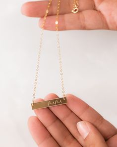 Express your love for your mama with our elegant mama bar necklace! This simple “mama” jewelry piece makes the sweetest Mother’s Day gift for mom or a new mom-to-be. Delicately engraved, our custom mom necklace serves as the perfect necklace for everyday wear. Layer this piece with our monogram disc necklace for an elegant look! Material: 14k gold filled, anti-tarnish material (will not turn blue or green and will not stain skin) Bar Size: 1.25” W x 0.25” H Chain Length: 16” with 2” chain extend Mama Jewelry, Skin Bar, Necklace For Everyday, Grandmas Jewelry, Grandma Necklace, Engraved Bar Necklace, Turn Blue, Silver Bar Necklace, Gold Bar Necklace