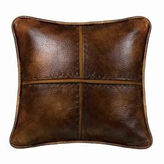 a brown leather pillow on a white background