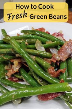 green beans and bacon on a white plate with the words how to cook fresh green beans