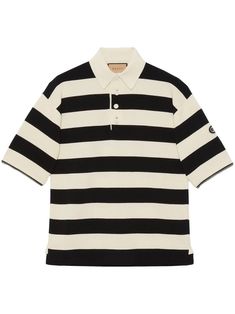 This exquisite knit cotton polo exudes a sense of luxury and style that is unparalleled. The ivory and black striped design is both timeless and fashion-forward, making it a versatile piece for any wardrobe. But what truly sets this polo apart is its detachable zipped sleeves, offering you the flexibility to transform your look with ease. Complete with a pointed collar, front buttoned placket, and the iconic GG patch on the left sleeve, this polo is a true statement of sophistication. Whether yo Gucci Polo Shirt, Rugby Design, Black Color Combination, Removable Sleeves, Detachable Sleeves, Pattern Logo, Mens Stripes, Knit Polo, Striped Polo Shirt