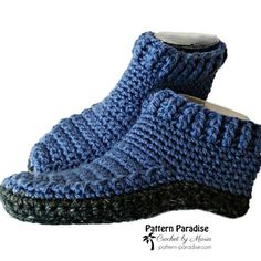 a pair of blue knitted slippers on top of each other