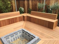 a wooden bench sitting on top of a wooden deck