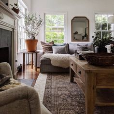 a living room filled with furniture and a fire place