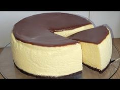 a chocolate and white cheesecake on a glass plate