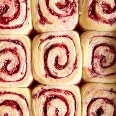 some very pretty looking pastries with red toppings