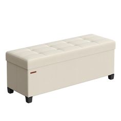 a white storage bench with black legs