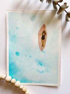 a watercolor painting of a woman on a surfboard in the middle of blue sky