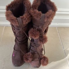 Brown Nike Fuzzy Boots For Cold Weather Nike High-top Winter Boots, Fuzzy Soft Boots, Casual Nike Winter Boots, Long Fuzzy Boots, Nike Brown High-top Boots, Nike High-top Synthetic Boots, Fluffy Boots Y2k, Brown Boots With Faux Fur Trim For Cold Weather, Brown Fuzzy Boots