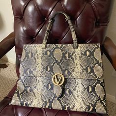 Mario Valentino Large Snakeskin Embossed Leather Handbag/Suitcase In Great Condition. 16”Wx12”Hx7”D. It Comes With A Black Shoulder Strap Which Is Never Used. No Scratches No Cuts No Stains, From A Pet Free Smoke Free Home. I Used This Bag To Carry Laptop, Documents, Folders & All. Super Versatile And Carries Everything. Perfect For Everyday Work! Designer Laptop Bag With Detachable Strap, Designer Rectangular Laptop Bag With Detachable Strap, Luxury Shoulder Laptop Bag With Top Carry Handle, Luxury Laptop Bag With Adjustable Strap, Luxury Laptop Bag With Adjustable Strap And Double Handle, Luxury Laptop Bag With Detachable Strap And Top Handle, Luxury Laptop Bag With Removable Pouch, Designer Top Handle Laptop Bag For Daily Use, Luxury Laptop Bag With Detachable Top Handle