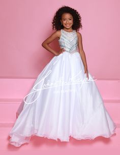 This Sugar Kayne C362 girls pageant dress features an elegant high neckline, a beautiful embellished bodice, and a princess waistline. Made with organza fabric, this dress is designed to make your little princess feel like royalty on stage. Perfect for any pageant or special occasion. Colors: Aqua/Multi, Pink/Multi, White/Multi Sizes: 2-16 Fitted Pageant Dress For Quinceanera During Prom Season, Embellished Princess Dress For Prom Season Pageant, Embellished Princess Dress For Prom Pageant, Embellished Princess Style Pageant Dress, Embellished Princess Dress For Prom Season Pageants, Princess Pageant Dress With Embellished Fitted Bodice, Quinceanera Embellished Pageant Dress With Fitted Bodice, Rhinestone Ball Gown For Prom And Pageant Season, Rhinestone Ball Gown For Prom Season Pageant