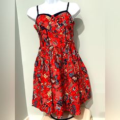 Floral Red And Navy Blue Dress Size Medium Above The Knees. Wear To A Cocktail Party Or A Casual Event, Pair It With Heels Or Cute Sandals And Rock That Look. Red Floral Print Mini Dress For Casual Occasions, Casual Lined Sundress For Party, Casual Red Sundress For Summer, Red Cotton Mini Dress For Party, Red Lined Dress For Day Out, Red Fitted Sundress With Lining, Red Party Sundress For Spring, Red Sundress For Spring Party, Red Floral Print Sundress For Casual Wear