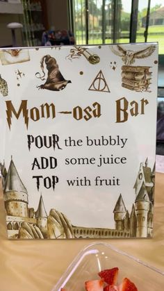 there is a sign that says mom - osa bar with strawberries in it