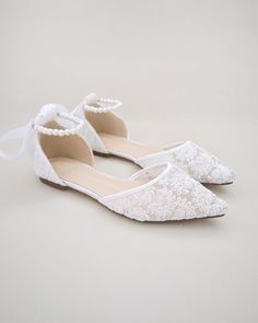 Crochet lace pointy toe flats for comfortable wear throughout your special day and perfect for wedding party. With pearl ankle strap to create a classic yet sophisticated look for any occasion. DETAILS: UPPER: Synthetic upper and lining MATERIALS: Manmade outsole HEEL HEIGHT: 0.3" ORIGIN: Imported Spring Wedding Shoes With Lace And Ankle Strap, Spring Wedding Shoes With Ankle Strap In Lace, Spring Lace Wedding Shoes With Ankle Strap, Chic Low Heel Ballet Flats For Wedding, Spring Bridesmaid Closed Toe Flats, Elegant Pointed Toe Flats With Ankle Strap For Wedding, Low Heel Wedding Flats For Spring, Elegant Wedding Pointed Toe Flats With Ankle Strap, Summer Wedding Ballet Flats With Low Heel