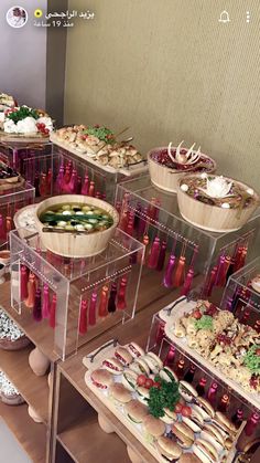 a buffet table filled with lots of food and condiments on top of it