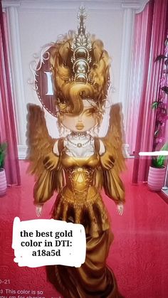 an image of a doll with wings on it's head in a pink room