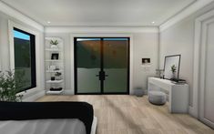 a bedroom with white walls and wooden floors