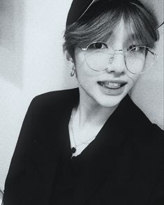 black and white photograph of a woman wearing glasses