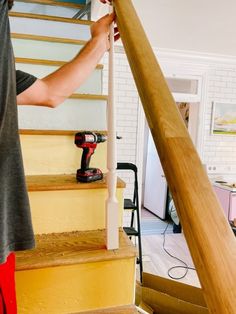 a man is working on some stairs with a cordless drill and an electric screwdriver