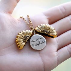 Inspired by the song of "You are my sunshine", this necklace is crafted by artisans on metal and the message “You are my sunshine” is hidden in the sunflower locket necklace, making a simple but interesting statement. Description: Necklace chain is adjustable (Approximately 19.68 “=16.9”+2.75” extension). Sunflower pendant is approximately 1.18” in diameter. Material: Stainless steel. Sunflower locket is available in 3 colors: gold, platinum and rose gold. This necklace is the perfect gift for w Open Locket, Sunshine Necklace, Message Necklace, Sunflower Pendant, Sunflower Necklace, Celtic Knots, Birthday Gifts For Girlfriend, Bff Gifts, Boho Gifts