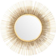 a gold sunburst mirror sitting on top of a white wall