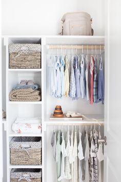 an organized closet with clothes and baskets