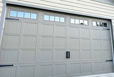 an image of a garage door with windows