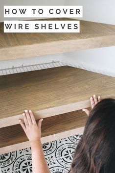 a woman is placing shelves on top of each other with the words how to cover wire shelves above them