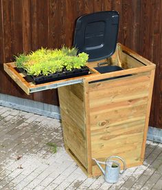 a wooden table with plants growing out of it and an instagram post about the garden furniture centre