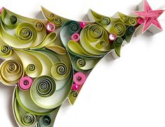 an origami christmas tree with pink, green and white swirls on it