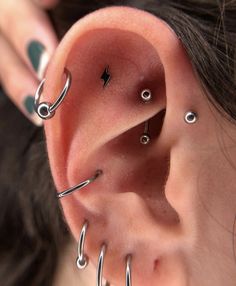 a woman with piercings on her ear