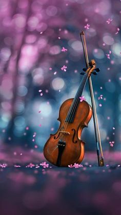 a painting of a violin and bow in the middle of a forest with pink flowers