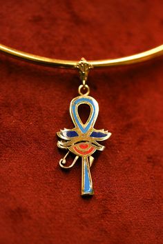 Embark on a voyage of self-discovery and spiritual enlightenment with the Ankh Key Necklace, a timeless symbol of eternal life and inner harmony. Delve into the intricate symbolism and profound meaning of this iconic necklace, which serves as a beacon of wisdom and a reminder of life's sacred journey. The Ankh Key, often referred to as the "key of life," is a revered symbol originating from ancient Egyptian mythology. Its design, resembling a cross with a loop at the top, represents the eternal Luxury Ankh Shaped Yellow Gold Necklace, Symbolic Medallion Jewelry For Ceremonial Occasion, Symbolic Ceremonial Medallion Jewelry, Symbolic Ankh Ceremonial Jewelry, Spiritual Ankh Necklace Collectible, Symbolic Ankh Jewelry For Meditation, Spiritual Ankh Necklace For Ceremonial Use, Blue Symbolic Collectible Jewelry, Blue Ankh Jewelry Gift