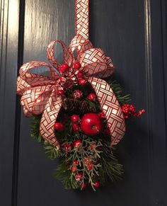 a christmas wreath hanging on the front door