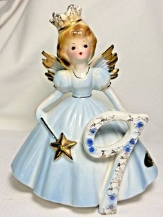 This beautiful figurine is a perfect addition to any room's decor. Celebrate a girl's 9th birthday with this vintage Japan 1960's JOSEF Originals Birthday Angel Girl Year figurine. The porcelain material and glossy finish make it a unique and special piece. The figurine features a small size of 5 1/4" and depicts a girl in a blue dress, perfect for any occasion. The Angel theme adds a touch of elegance to the piece, making it a great gift for collectors or anyone who loves vintage items. This original piece is not customized and is part of the Growing Up Girls collection. Add it to your decorative collectibles or sculpture collection today. Josef Originals and Japan Foil labels. Girls 9th Birthday, Angel Theme, Josef Originals, Birthday Angel, Growing Up Girl, Foil Label, Year 9, Angel Girl, Girls Collection