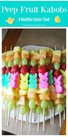 there are many different fruits and vegetables on the plate with strawberries in the shape of bunnies