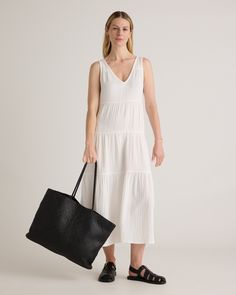 The ultimate slip on and step out style, this easy-to-wear dress still packs a fashionable punch. Made of breezy, lightweight organic cotton gauze, it features a v-neck in the front and back and flowy tiered bodice. Slide into a pair of sandals and top with a few pieces of jewelry and you’ve got a full look.  | Quince | Women's Gauze Tiered Maxi Dress in White, Size Medium, Organic Cotton Casual V-neck Dress For Everyday, Effortless Summer Dresses For Everyday, Everyday V-neck Summer Dresses, Chic Summer Maxi Dress For Everyday, Chic Everyday Maxi Dress For Summer, Flowy V-neck Tiered Dress For Beach, Summer Beach Cover-up Cotton Gauze Dress, Summer Beach Cover-up Dress In Cotton Gauze, V-neck Cotton Gauze Beach Dress