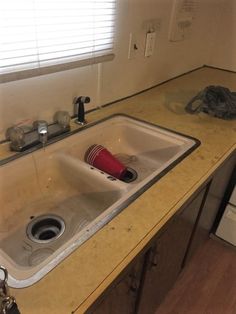 the kitchen sink is clean and ready for us to use in its new home,