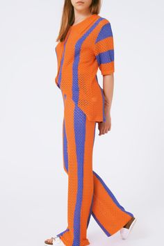 Elevate your casual look with our Orange Striped Crochet Pants. Crafted from a blend of 85% viscose and 15% nylon, these pants offer a comfortable and lightweight feel. The high-rise waist provides a flattering fit, while the full-length design adds a touch of elegance. With their stripe design and straight leg cut, these pants are both stylish and versatile. Our model, with measurements 32-24-35 and a height of 5'9", is wearing size U, which runs small - we recommend sizing up. Perfect for a ca Pants Print, Crochet Pants, Modern Trend, Perfect Wardrobe, Draped Fabric, Fine Knit, Fast Fashion, Belted Dress, Casual Wardrobe