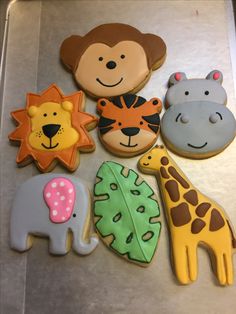 decorated cookies in the shape of animals and giraffes